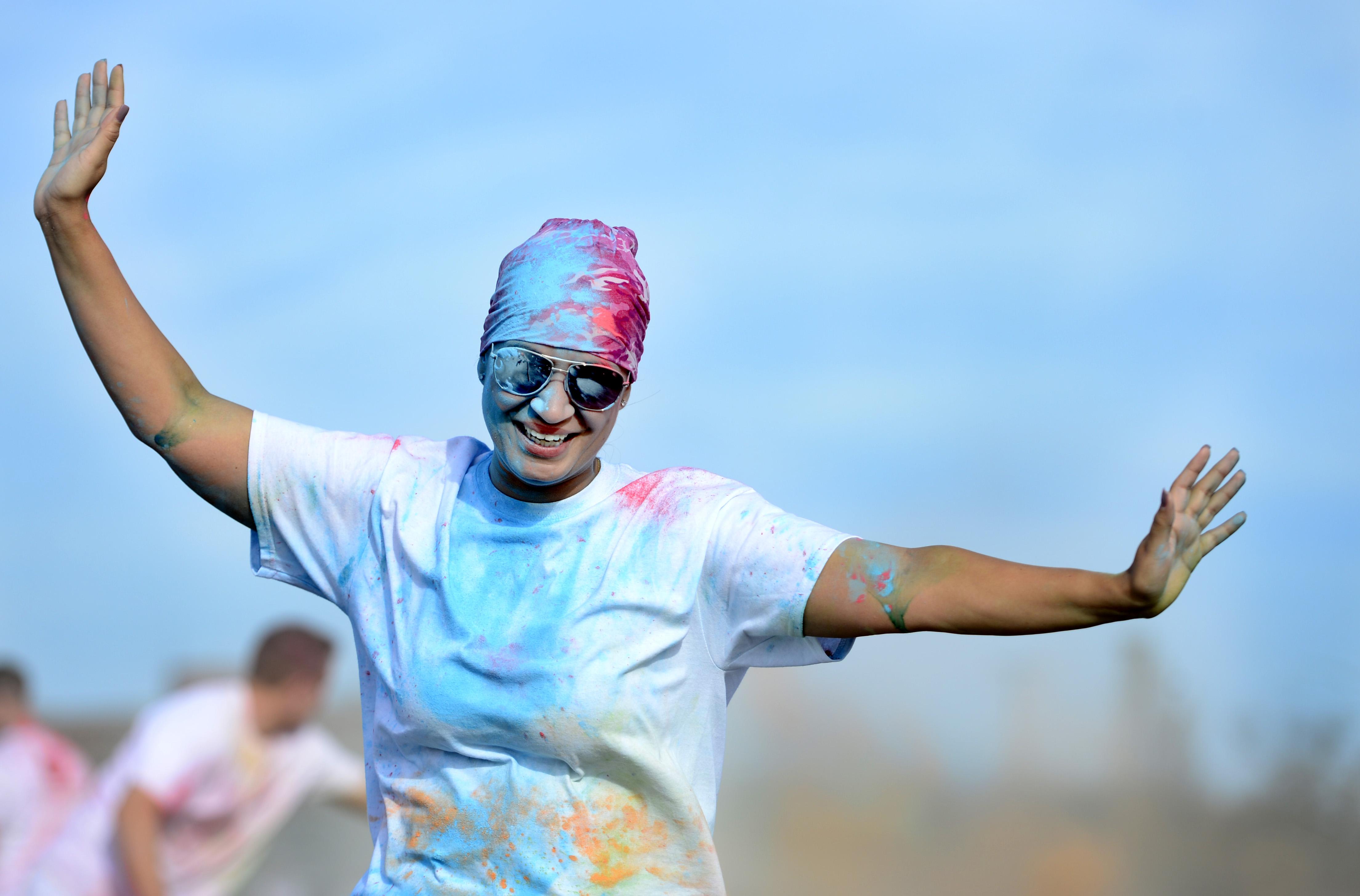 A runner participates in the Joint Base Langley-Eustis Resiliency 5K Color Run at Langley Air Force Base, Va., Oct. 29, 2015. Runners wore shirts highlighting Comprehensive Airman Fitness which promotes a resilient Air Force community that fosters mental, physical, social and spiritual fitness. (U.S. Air Force photo by Senior Airman Kayla Newman/Released)